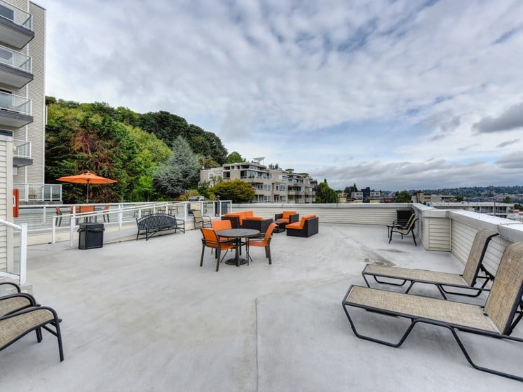 Rooftop Lounge with Lounge Chairs, Orange Chairs and Trees